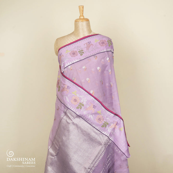 Purple Kota doria silk saree with silver zari floral butta, chevron pallu and floral zari border with yellow blouse