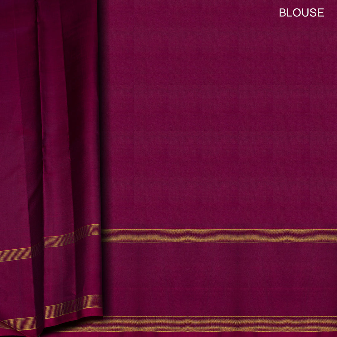Peacock green Kanjivaram silk saree with gold zari stripes, annam and chakram butta, magenta rettapet border and detailed pallu with matching blouse