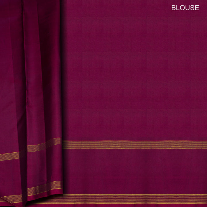 Peacock green Kanjivaram silk saree with gold zari stripes, annam and chakram butta, magenta rettapet border and detailed pallu with matching blouse