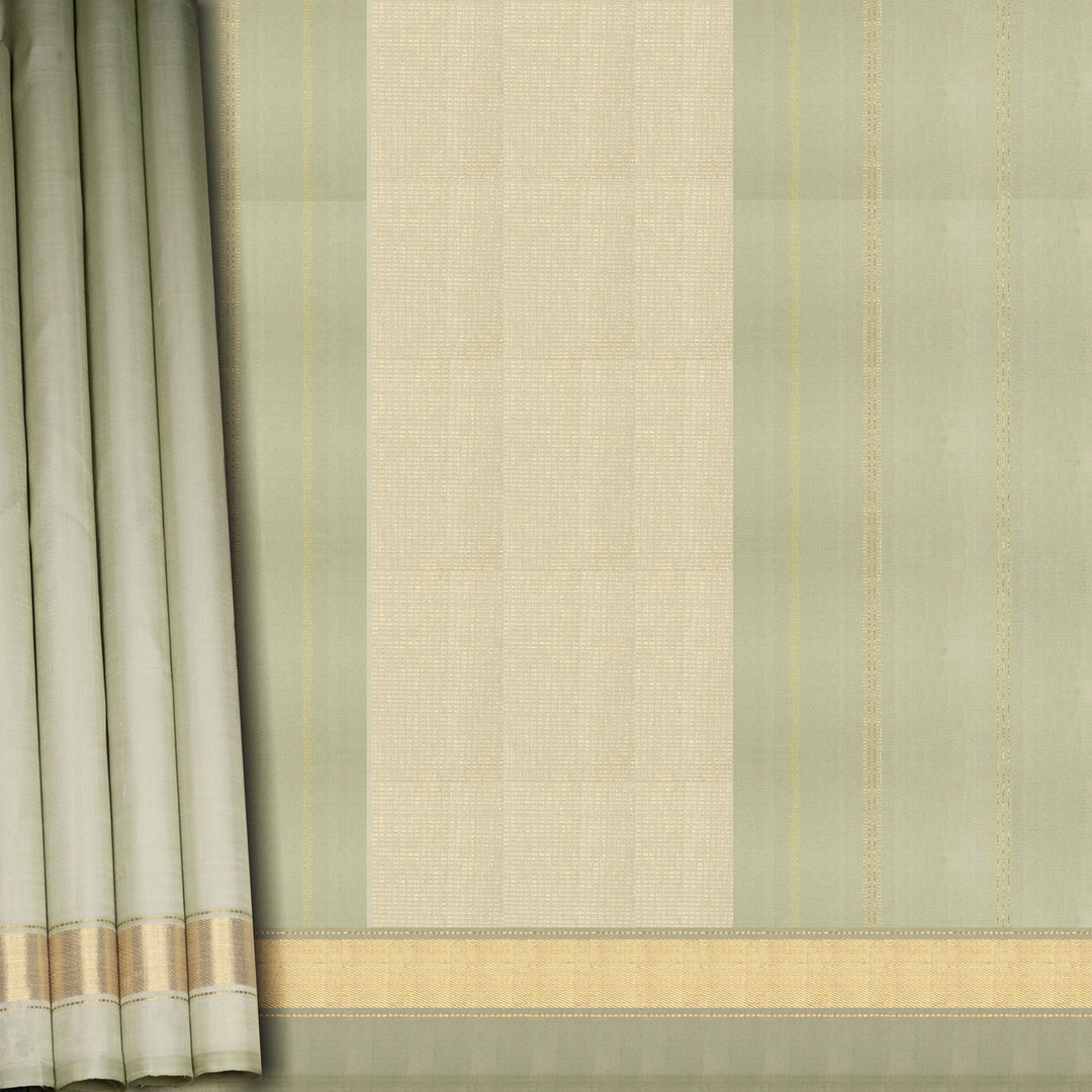 Light green Kanjivaram silk saree with gold zari diagonal chevron lines and striped panel pallu with matching blouse