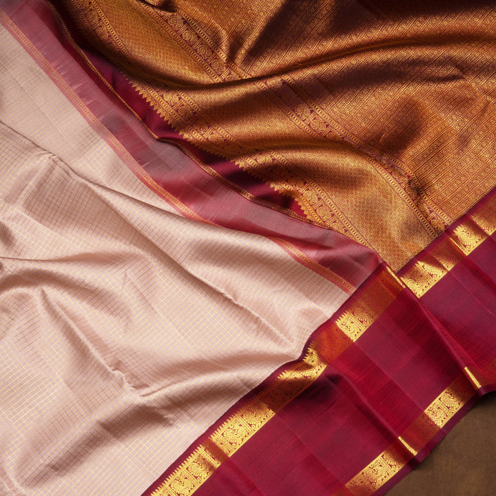 Mauve Kanjivaram silk saree with vairaoosi checks, maroon rettapet annam border and rich diamond pallu with matching blouse
