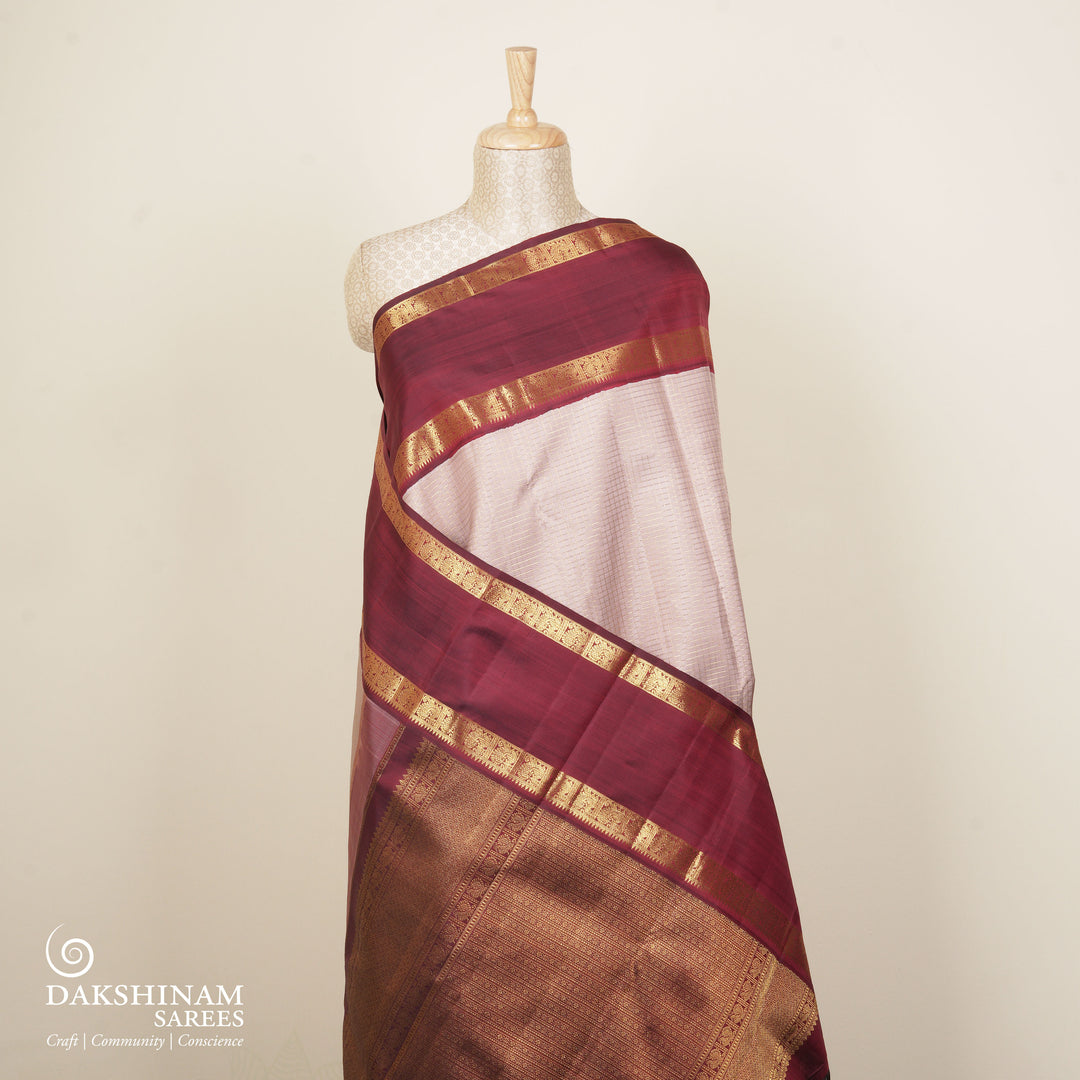 Mauve Kanjivaram silk saree with vairaoosi checks, maroon rettapet annam border and rich diamond pallu with matching blouse