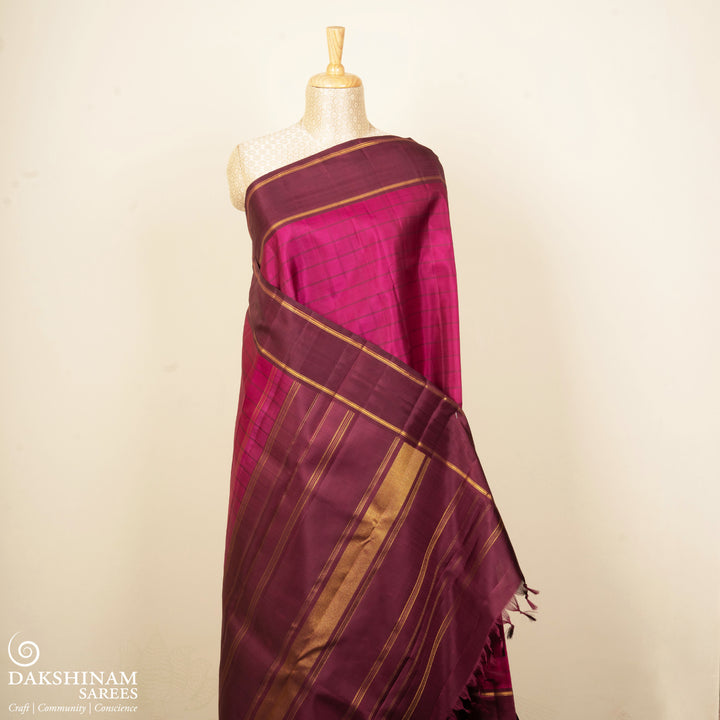 Magenta Kanjivaram silk saree with checks, maroon gold zari rettapet border and striped pallu with matching blouse