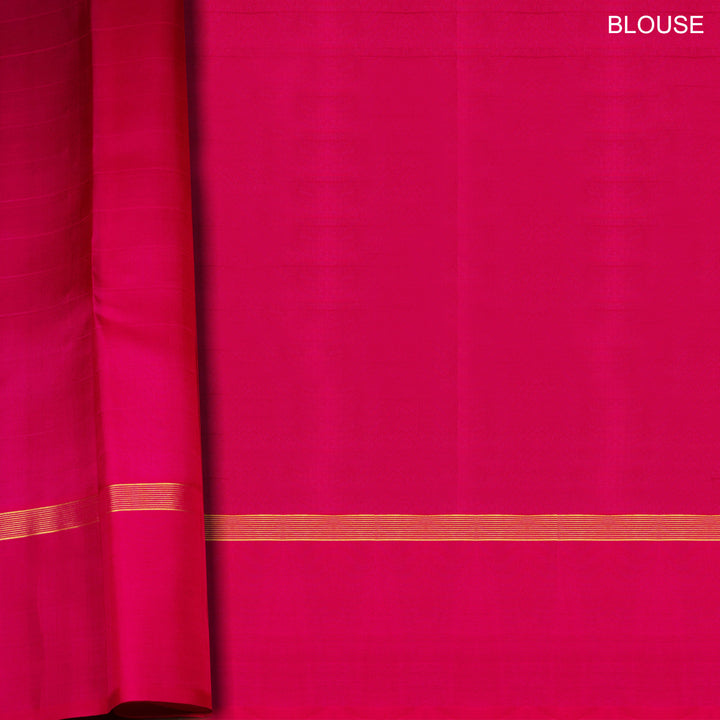 Orange Kanjivaram silk saree with checks, chakram and mango butta, magenta leaf border and vaira mookuthi pallu with matching blouse