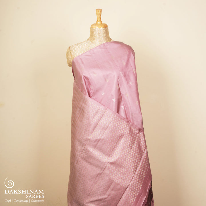 Light pink Kanjivaram silk saree with brocade body, gold and silver zari butta and triangle pallu with matching blouse