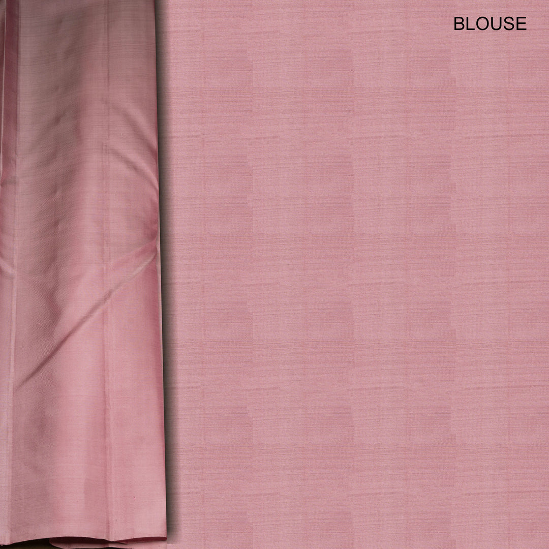 Light pink Kanjivaram silk saree with brocade body, gold and silver zari butta and triangle pallu with matching blouse