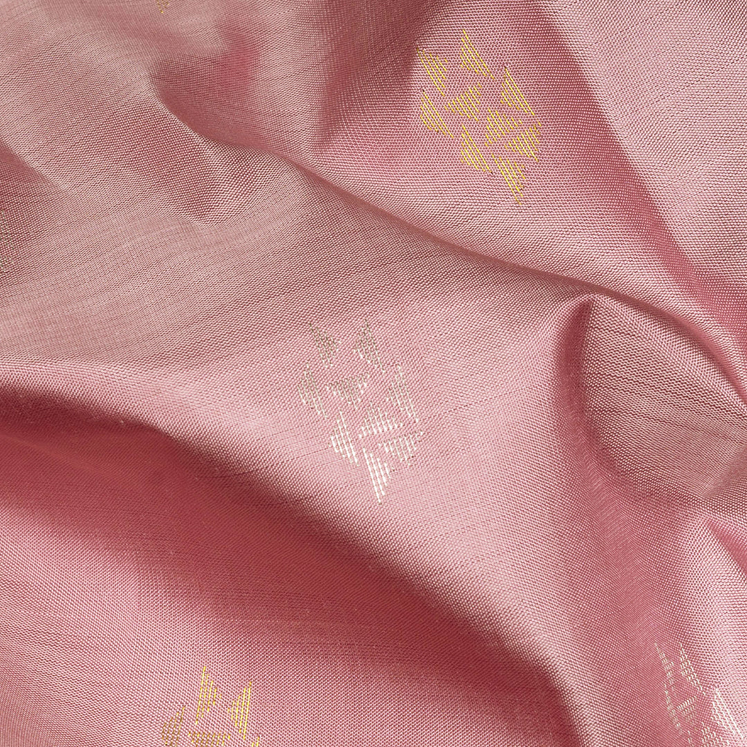 Light pink Kanjivaram silk saree with brocade body, gold and silver zari butta and triangle pallu with matching blouse