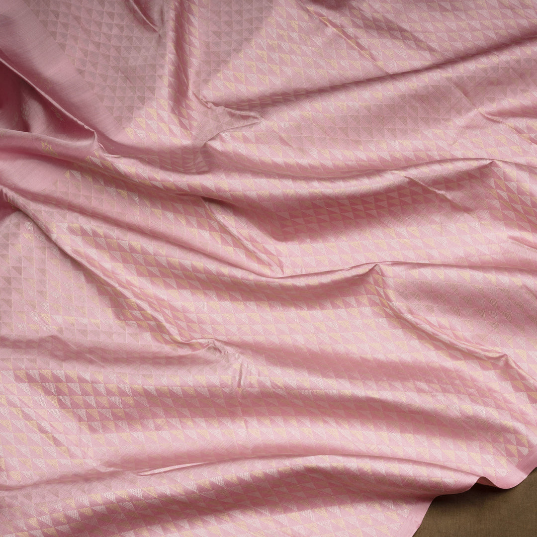 Light pink Kanjivaram silk saree with brocade body, gold and silver zari butta and triangle pallu with matching blouse