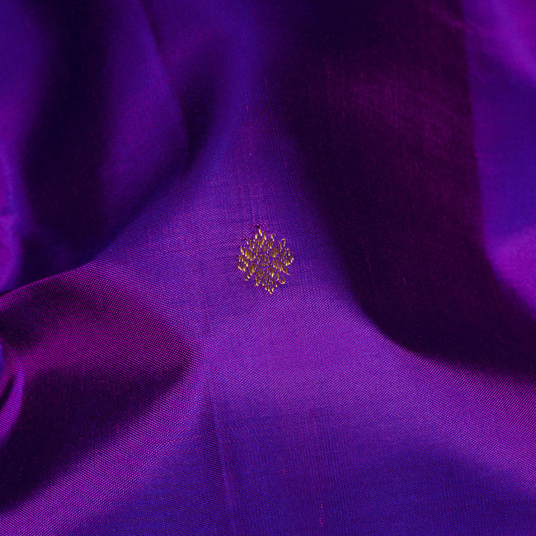 Violet Kanjivaram silk saree with diamond and annam butta, orange chevron border and gold zari striped pallu with contrast blouse