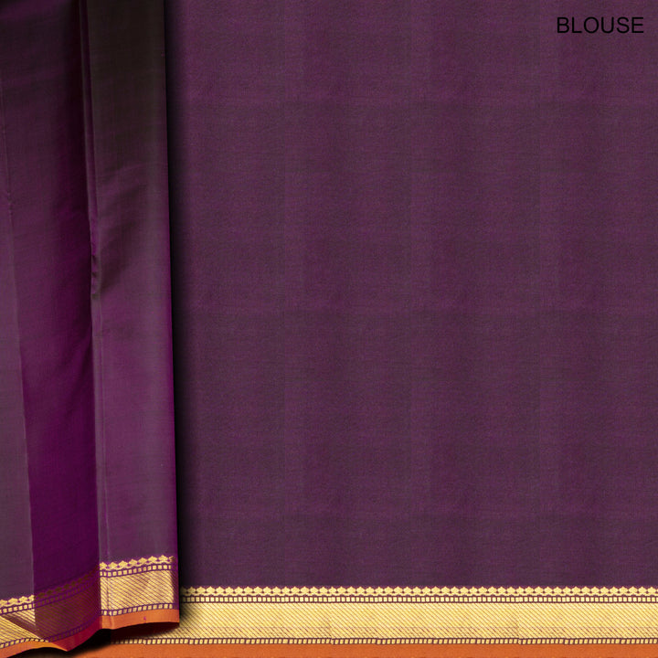 Violet Kanjivaram silk saree with diamond and annam butta, orange chevron border and gold zari striped pallu with contrast blouse