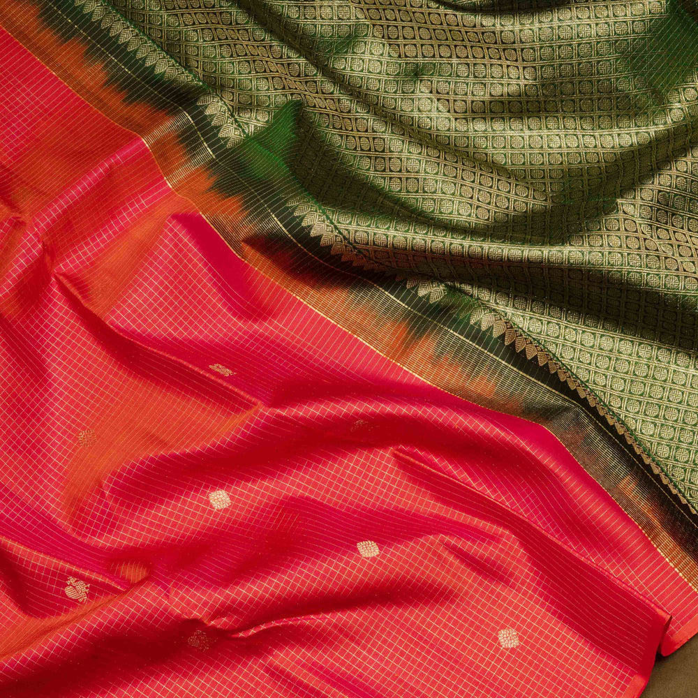 Orange Kanjivaram silk saree with pink-tone vairoosi checks, annam and vaira mookuthi butta, green pallu and matching blouse