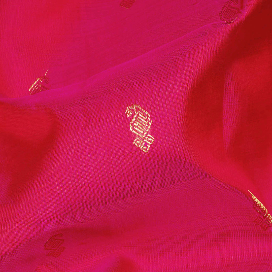Pink Kanjivaram silk saree with gold zari mango butta, light pink pallu with peacock and elephant motifs, and matching blouse