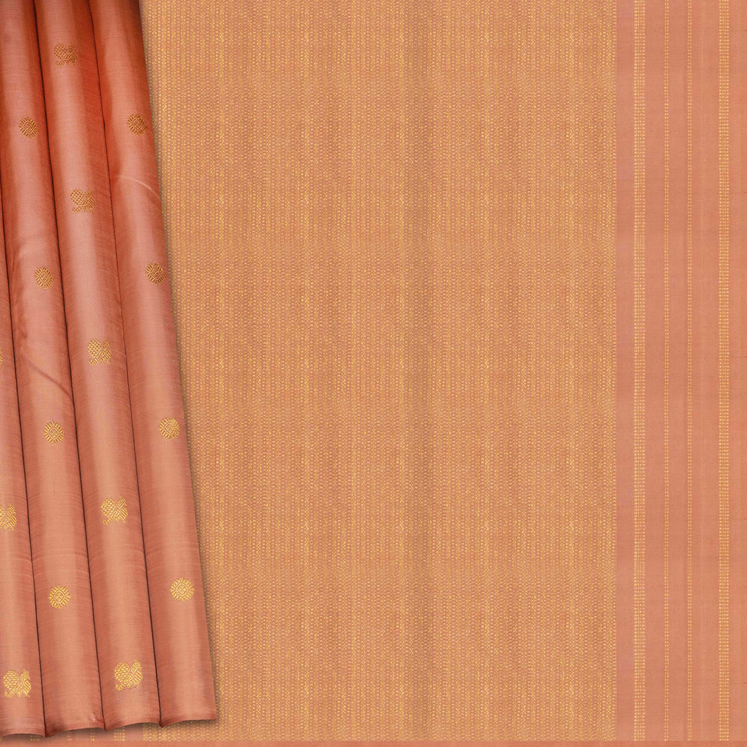 Beige peach Kanjivaram silk saree with annam and chakram butta, gold zari lined pallu and matching monotone blouse