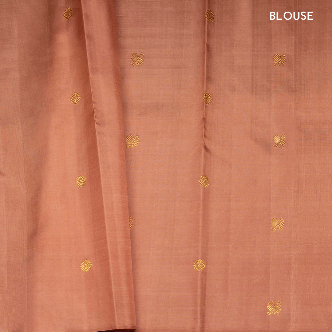 Beige peach Kanjivaram silk saree with annam and chakram butta, gold zari lined pallu and matching monotone blouse