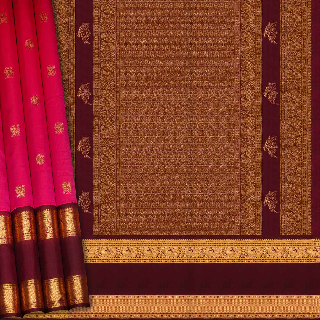 Pink Kanjivaram silk saree with annam and chakram butta, maroon rettapet border and rich traditional pallu with matching blouse