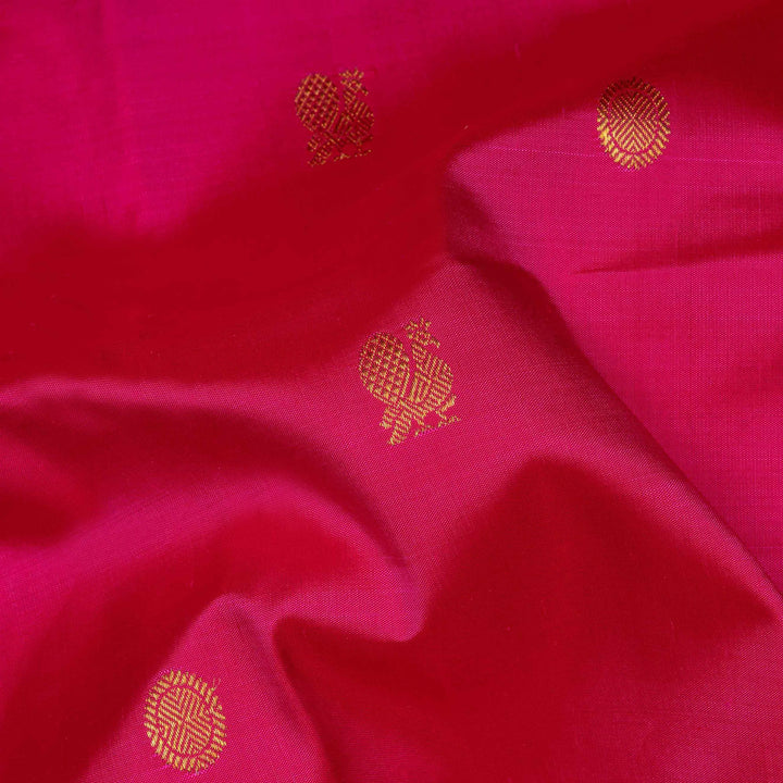Pink Kanjivaram silk saree with annam and chakram butta, maroon rettapet border and rich traditional pallu with matching blouse