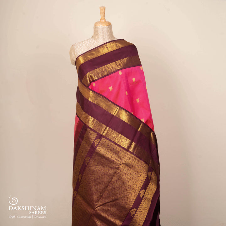 Pink Kanjivaram silk saree with annam and chakram butta, maroon rettapet border and rich traditional pallu with matching blouse