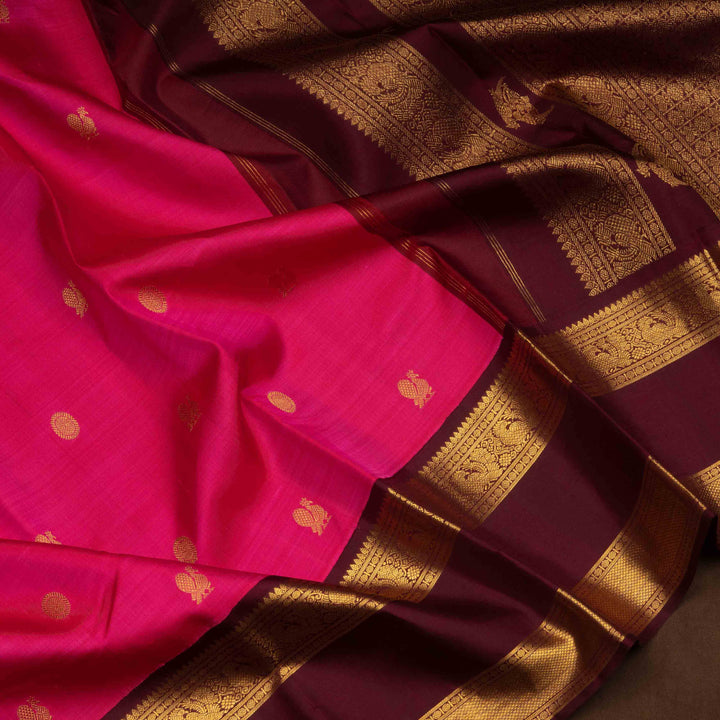 Pink Kanjivaram silk saree with annam and chakram butta, maroon rettapet border and rich traditional pallu with matching blouse