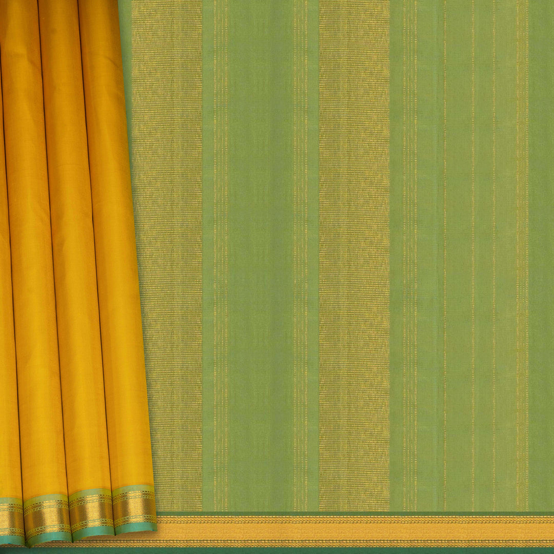 Yellow Kanjivaram silk saree with plain body, aqua blue dual-tone getti border and blue green paneled pallu with matching blouse