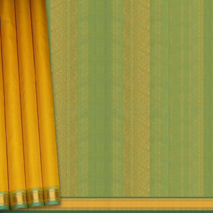 Yellow Kanjivaram silk saree with plain body, aqua blue dual-tone getti border and blue green paneled pallu with matching blouse