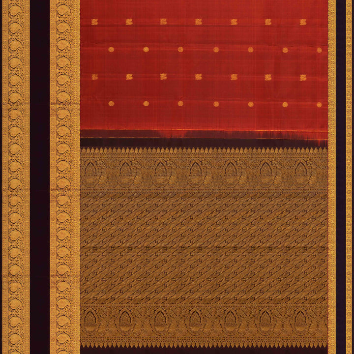 Rust orange Kanjivaram silk saree with annam and chakram butta, brown rettapet border and rich traditional pallu with matching blouse