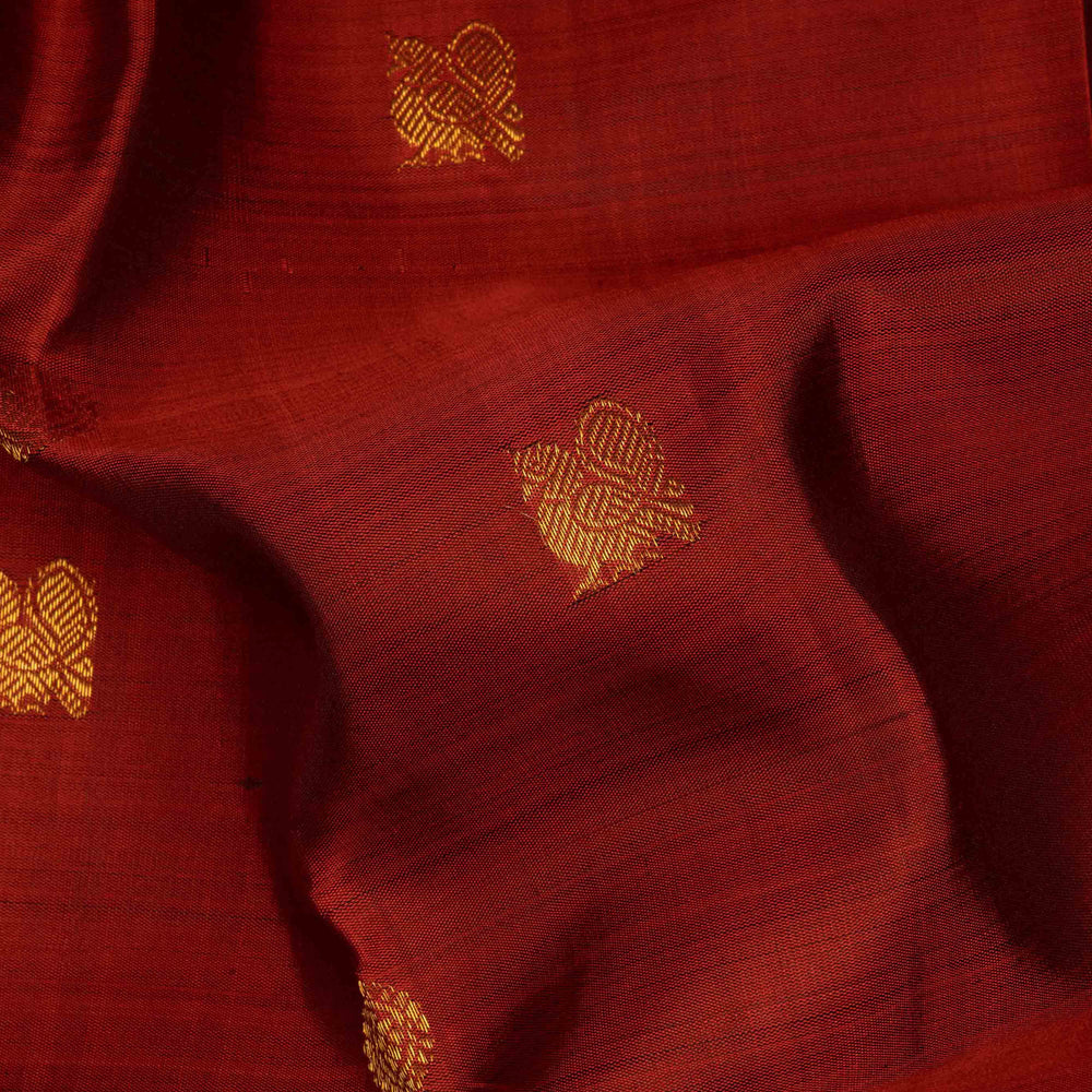 Rust orange Kanjivaram silk saree with annam and chakram butta, brown rettapet border and rich traditional pallu with matching blouse