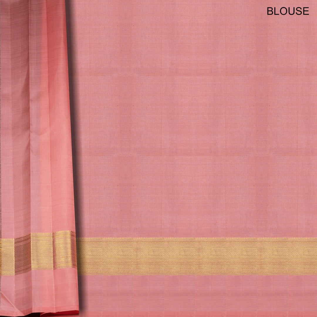 Light peach Kanjivaram silk saree with vairam buttas, peach pink border featuring temple and chevron designs, and detailed zari pallu, paired with plain blouse.