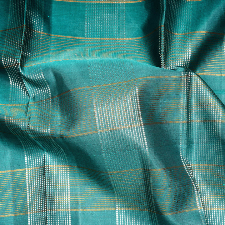 Aqua blue Kanjivaram silk saree with gold and silver zari checks, taupe brown temple border and matching blouse