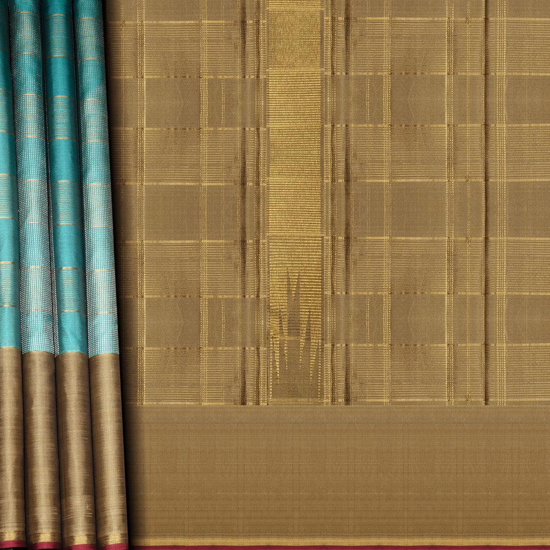 Aqua blue Kanjivaram silk saree with gold and silver zari checks, taupe brown temple border and matching blouse