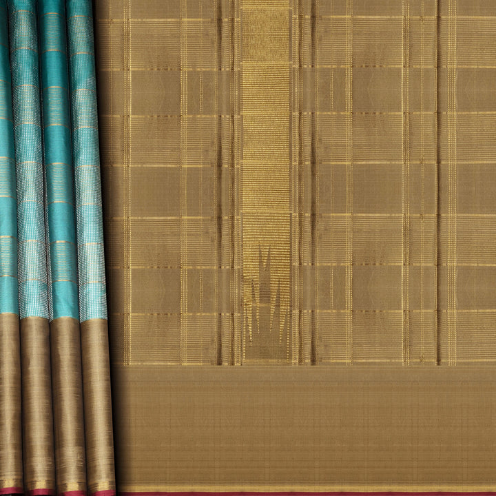 Aqua blue Kanjivaram silk saree with gold and silver zari checks, taupe brown temple border and matching blouse