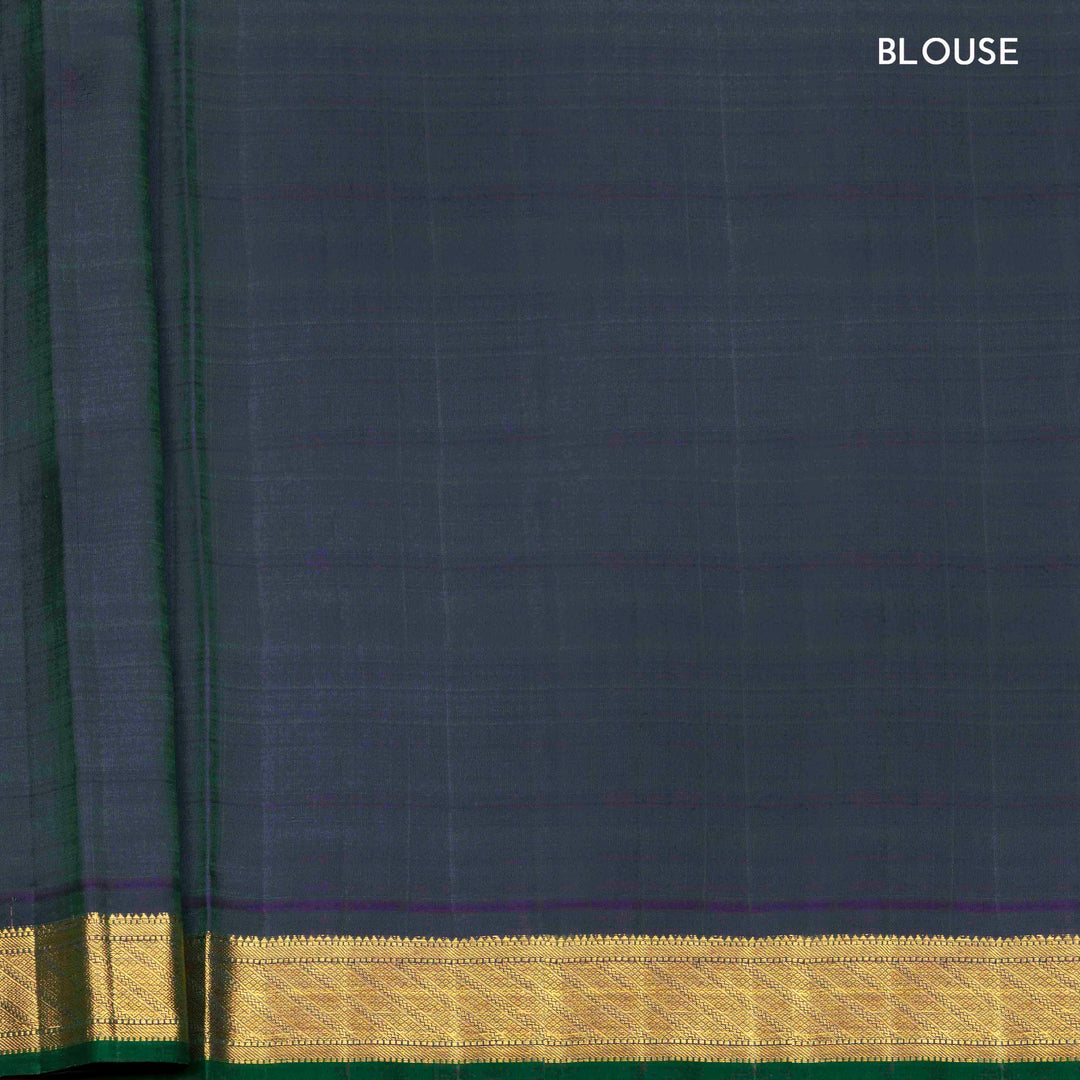 Peacock blue Kanjivaram silk saree with floral butta, dark blue zari border and diamond panel pallu with matching blouse