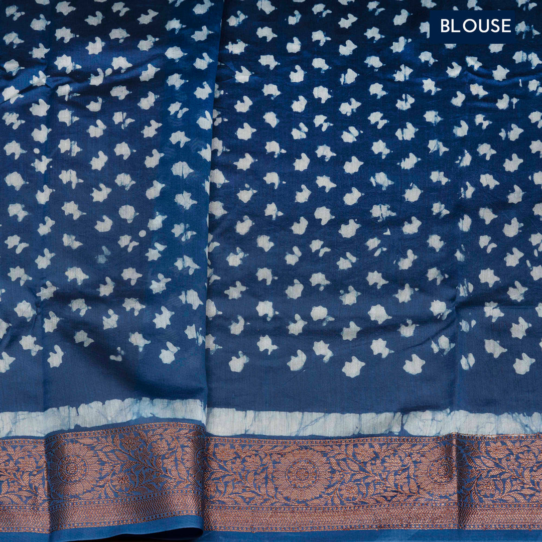 Blue Chanderi silk cotton saree with white batik print, copper zari floral border and batik mango pallu