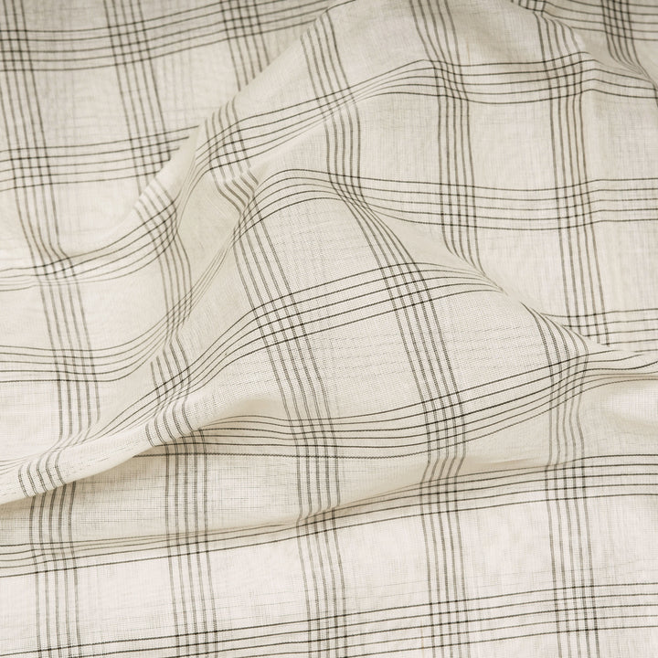 White Gadwal cotton saree with black checks, red Korvai temple border and brown pallu