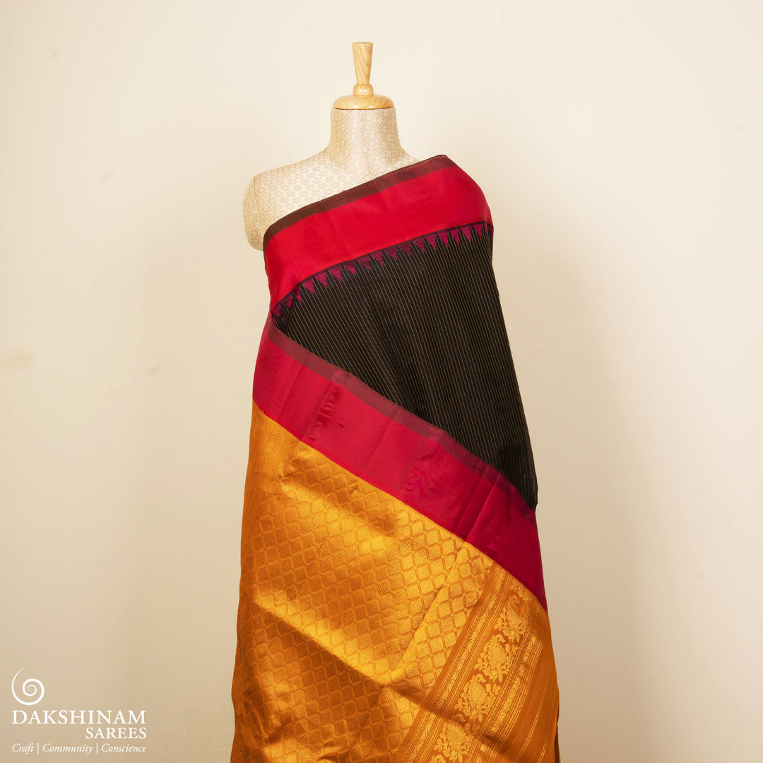 Brown Gadwal cotton saree with yellow stripes, pink Korvai temple border and mustard silk pallu