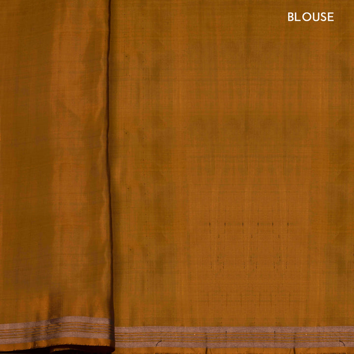 Mustard handwoven Ikat soft silk saree with white Ikat motifs and matching border