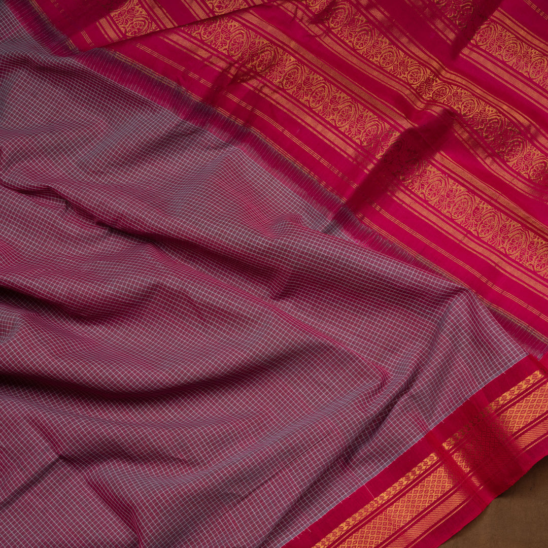 Violet checked Gadwal cotton saree with pink Korvai silk border, gold zari diamond motifs and pink silk pallu