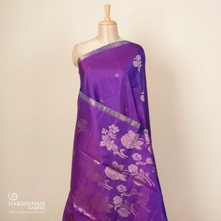 Violet handwoven soft silk saree with gold zari diamond buttas, floral motifs and rose gold zari pallu
