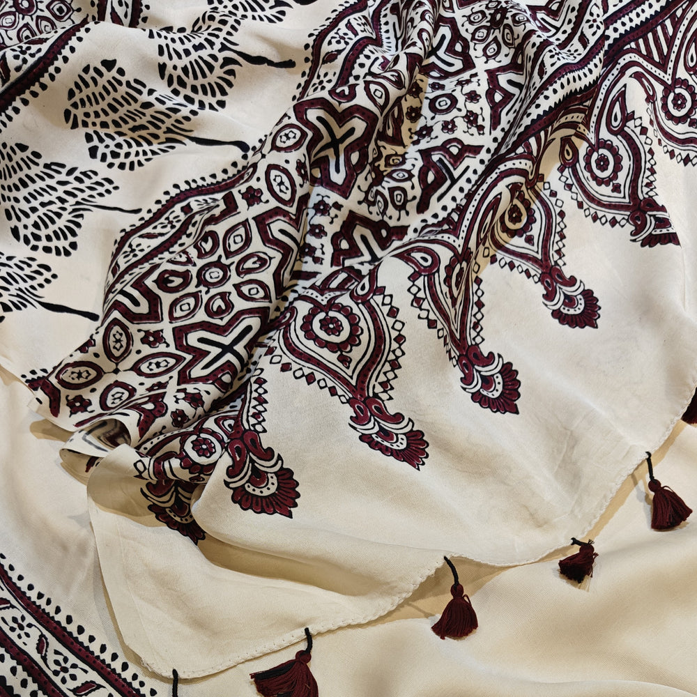 White with intricate black and red patterns
