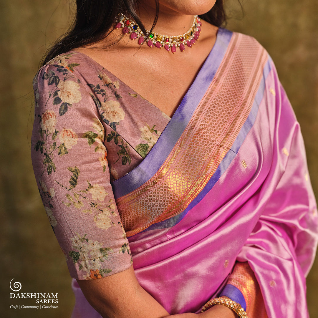 Lavender Paithani silk saree with gold zari paisley buttas, blue selvedge border with mayil motifs and traditional peacock pallu.