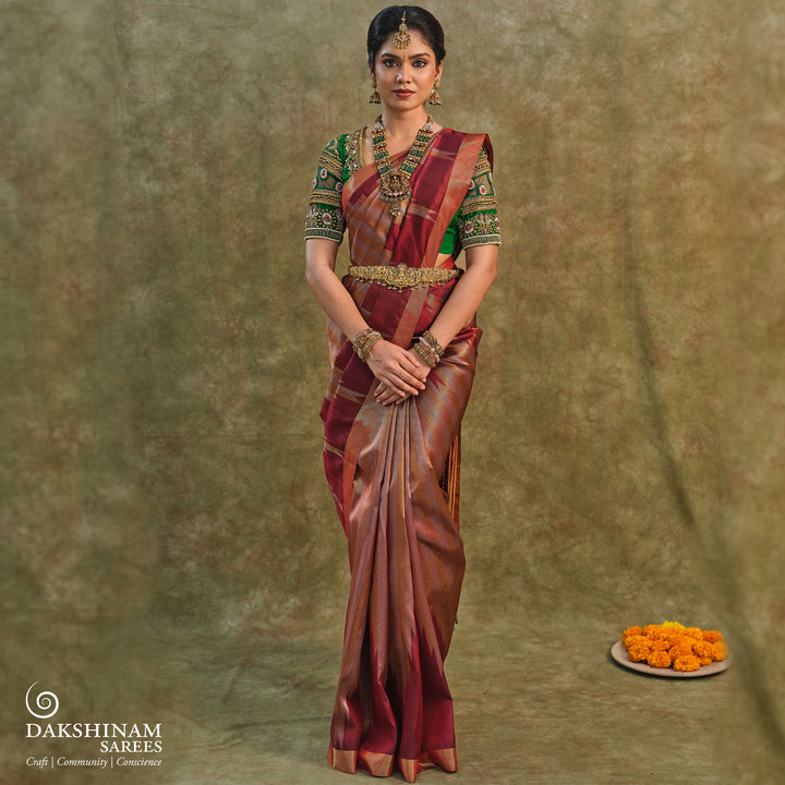 Maroon Kanjivaram silk saree with gold and silver tissue zari and temple border design