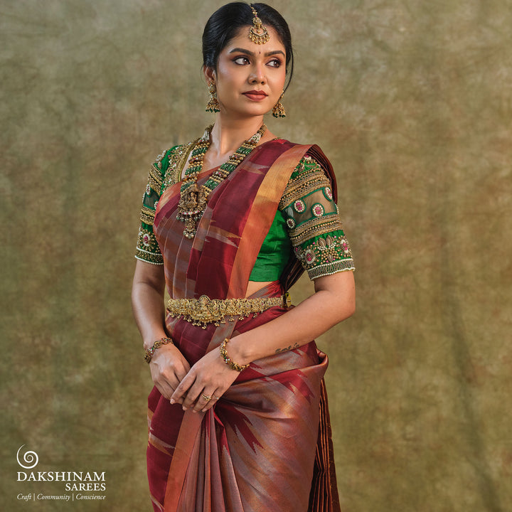 Maroon Kanjivaram silk saree with gold and silver tissue zari and temple border design