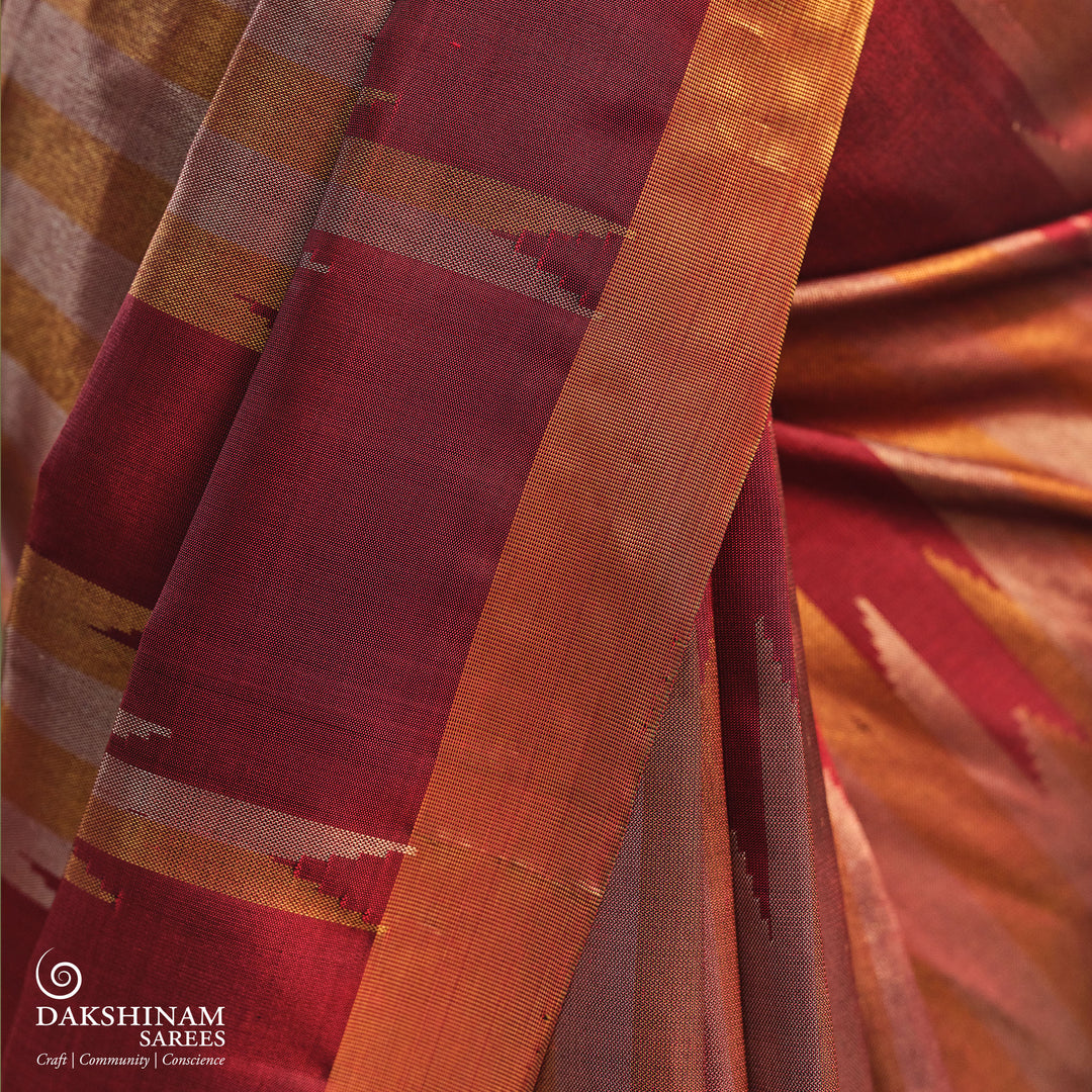 Maroon Kanjivaram silk saree with gold and silver tissue zari and temple border design