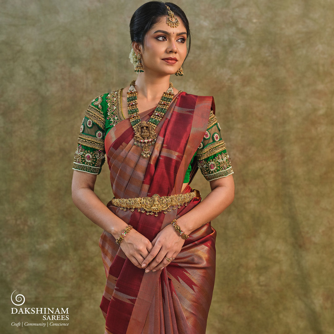 Maroon Kanjivaram silk saree with gold and silver tissue zari and temple border design