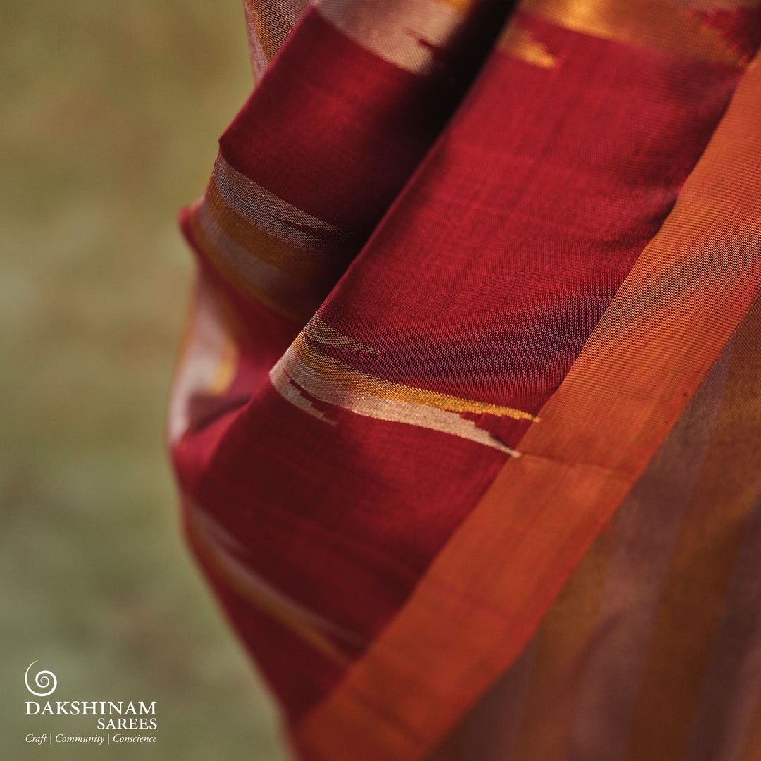 Maroon Kanjivaram silk saree with gold and silver tissue zari and temple border design