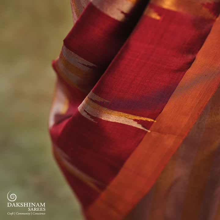 Maroon Kanjivaram silk saree with gold and silver tissue zari and temple border design