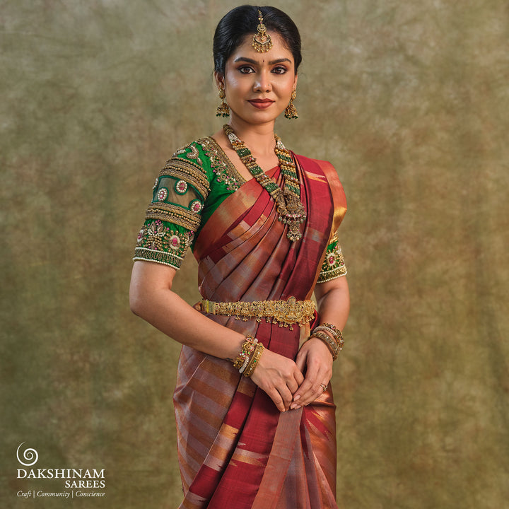Maroon Kanjivaram silk saree with gold and silver tissue zari and temple border design