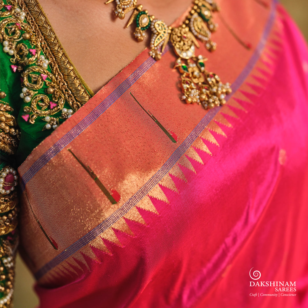 Pink Paithani silk saree with gold zari dotted body, tissue border with Munia motifs and multicolor parrot pallu.