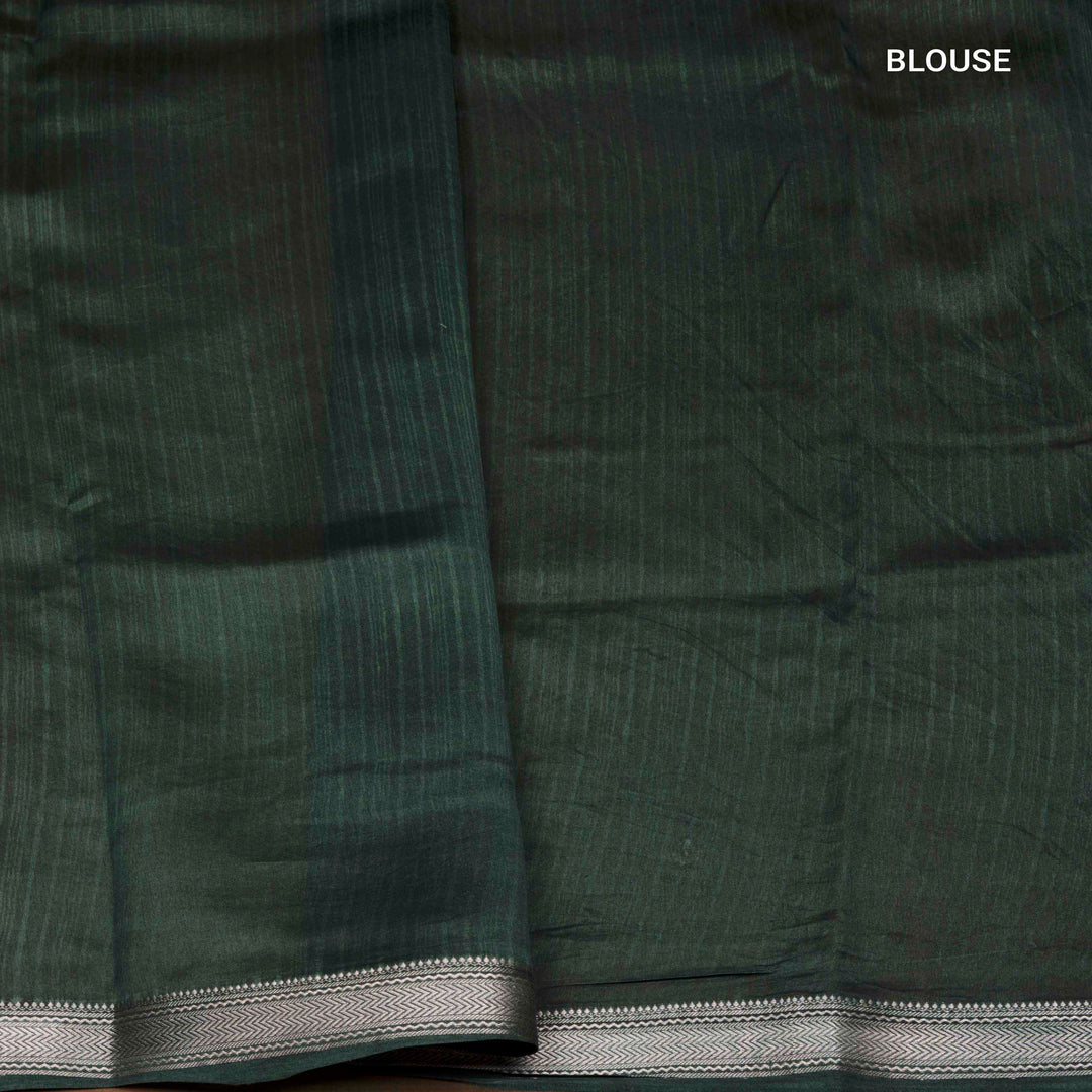 Green Chanderi silk cotton saree with white leaf print, silver zari border and striped pallu