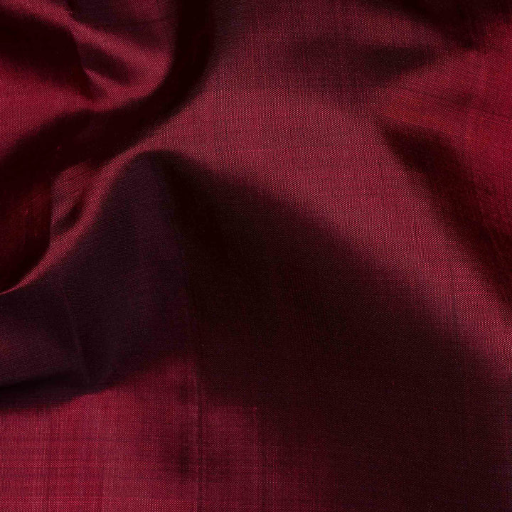 Maroon handwoven Kanjivaram silk saree with mango yellow border, gold zari and contrast pallu