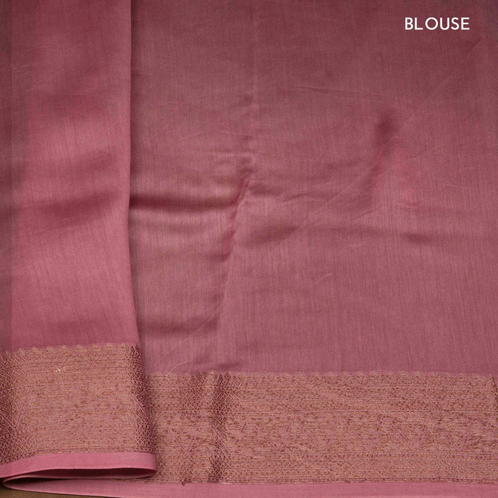 Pink Chanderi silk cotton saree with white floral print, gold zari border and striped pallu